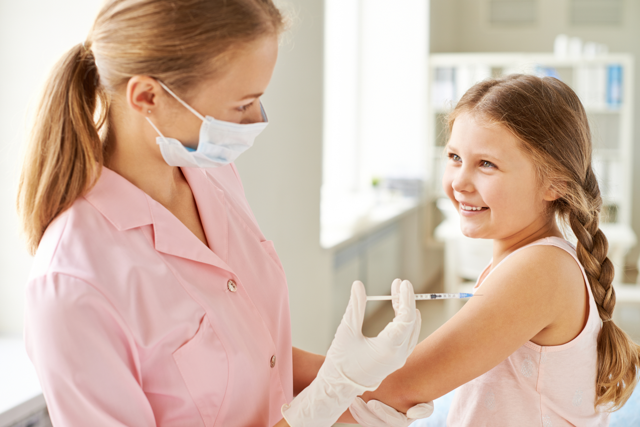 nurse-injecting-smiling-girl